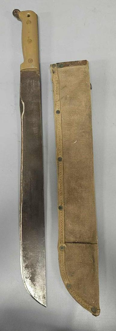 1945 WWII US True Temper machete with soft scabbard: 1946 WWII US True Temper machete with soft scabbard, missing a small piece of the handLow Estimate on both sides where the lanyard would have gone through, not bad otherwise as seen in the photos.
