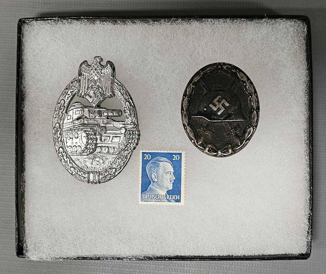 WWII German silver Panzer assault badge black wound badge and Hitler postage stamp: WWII German silver Panzer assault badge black wound badge and Hitler postage stamp in a small Riker frame. All in excellent condition as seen in the photos.