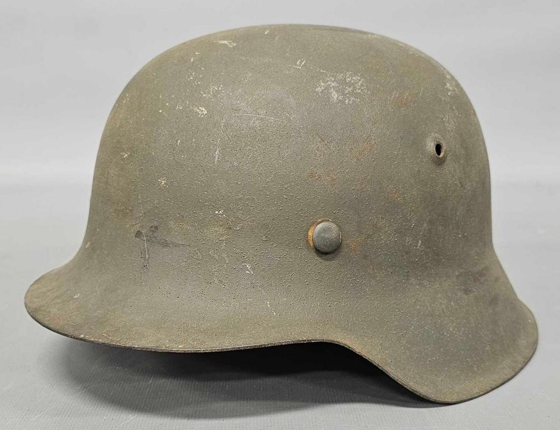 WWII German Nazi M40 helmet: WWII German Nazi M40 helmet, no liner and no decals. Sold as-is as seen in the photos with no returns.