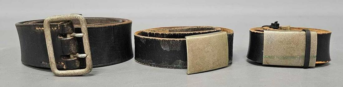 Three German leather belts with different buckles: Three German leather belts with different buckles, good condition as seen in the photos.