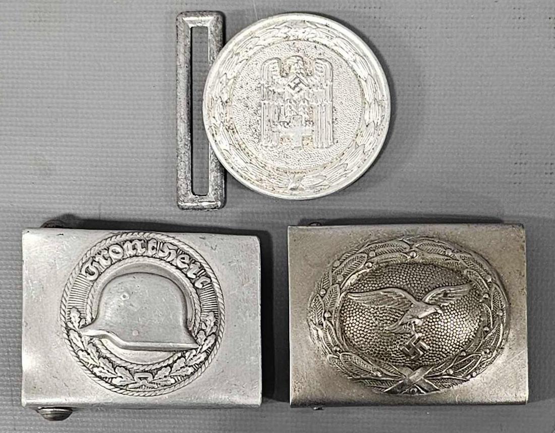 Three German aluminum belt buckles: Three German aluminum belt buckles to include Luftwaffe, Stalhelm and Officers red Cross as seen in the photos.