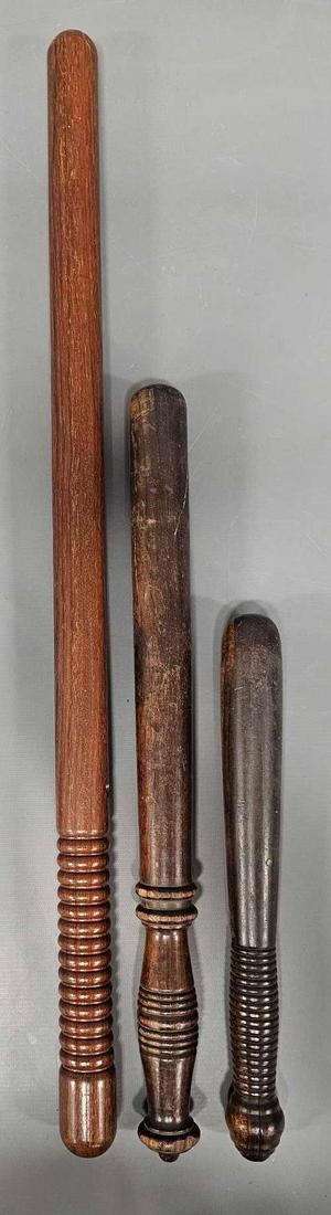 Three wooden police night sticks billy clubs: Three wooden police night sticks billy clubs, all three are in nice shape but have no straps. The shortest is 12 inches while the longest is 26 inches as seen in the photos.