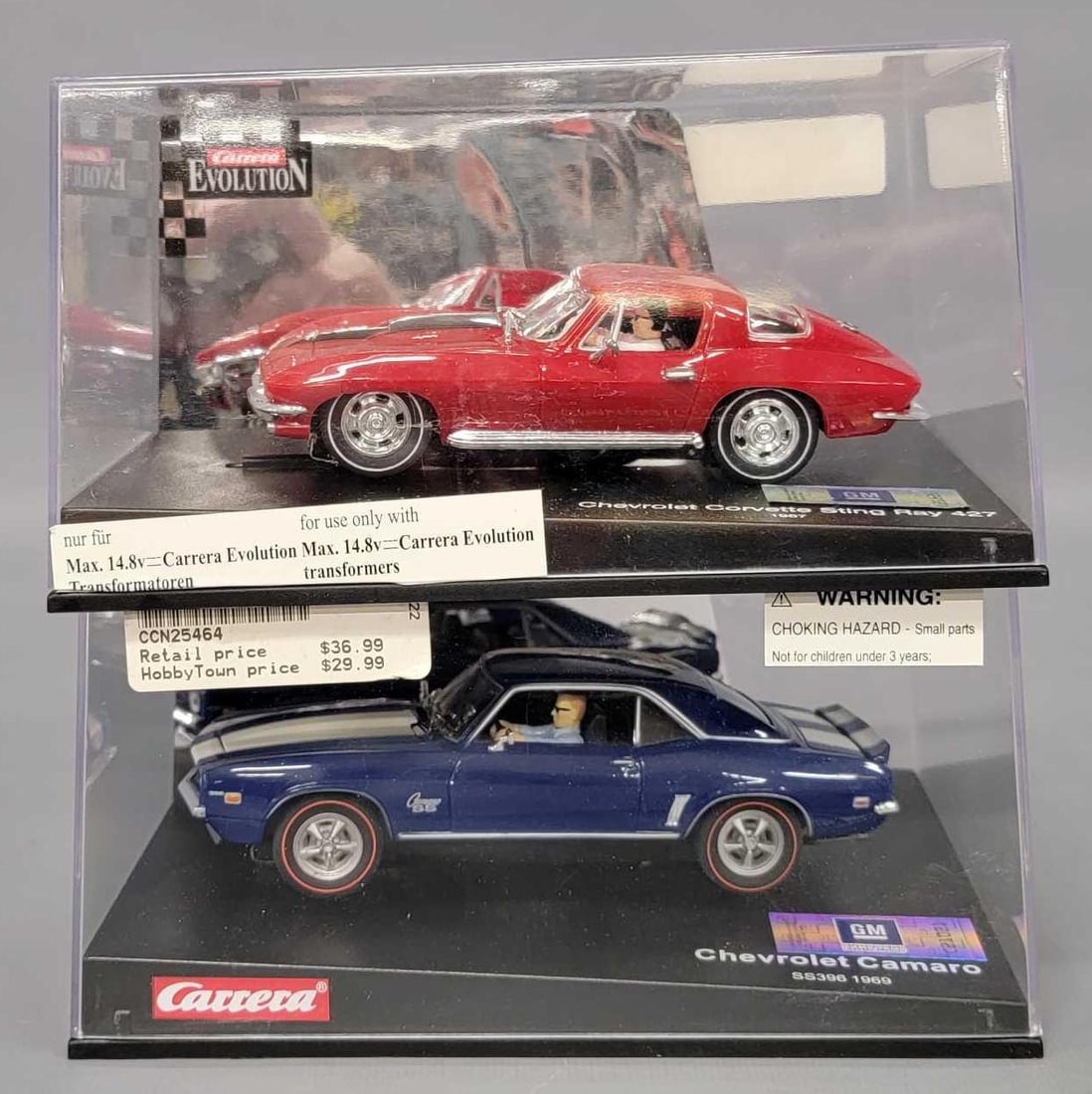 Two Carrera Evolution 1/32 slot cars in original boxes (1 of 7)