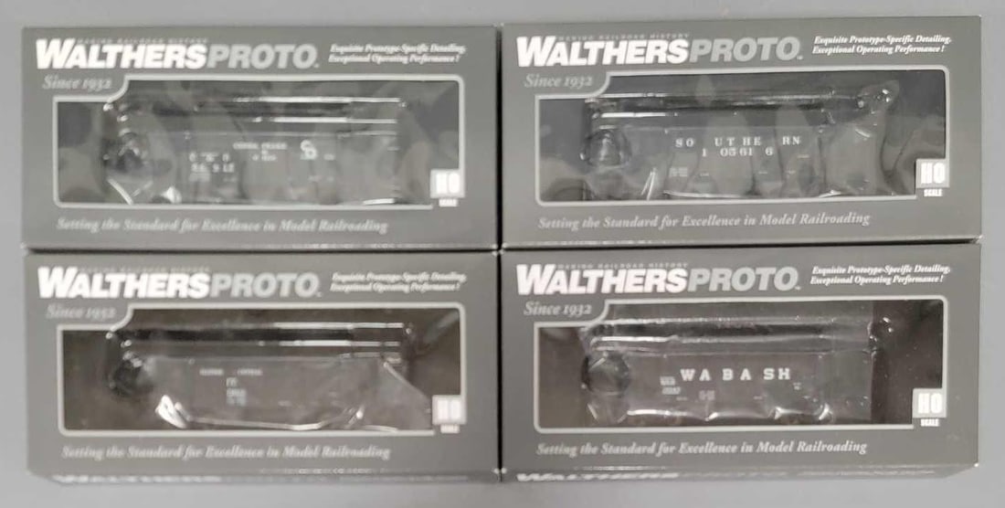 Four Walthers Proto HO 34 foot steel sheathed war hoppers in original boxes: Four Walthers Proto HO 34 foot steel sheathed war hoppers in original boxes to include Chesapeake and Ohio, Illinois Central, Southern and Wabash, all C9-10 in excellent original boxes as seen in the 