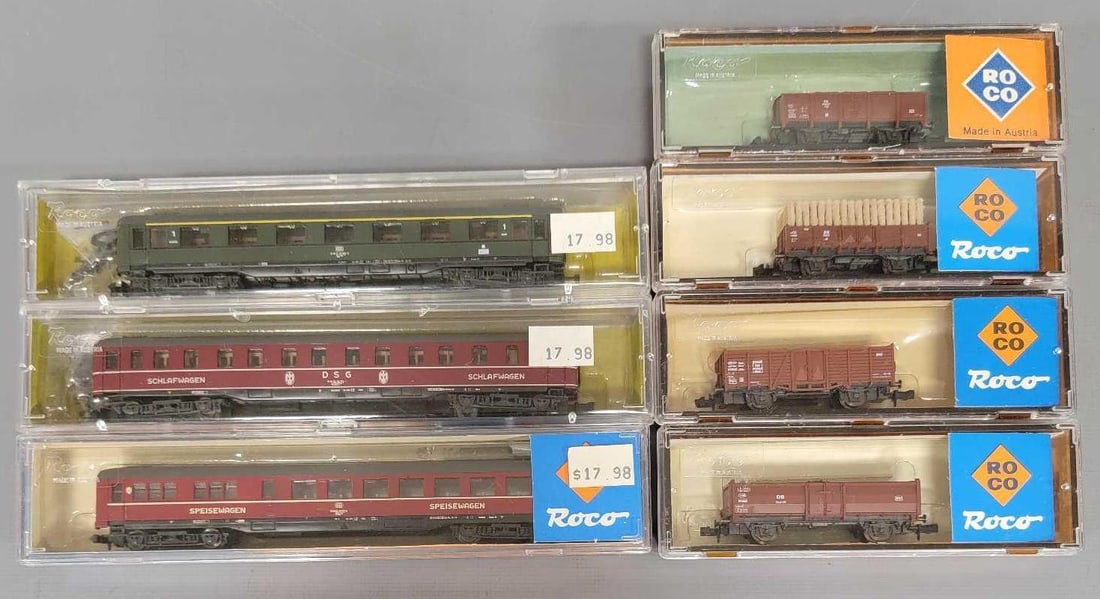 Group of seven Roco N scale freight and passenger cars in original boxes: Group of seven Roco N scale freight and passenger cars in original boxes to include four freight and three passenger cars, all show light run time in excellent jewel cases as seen in the photos.