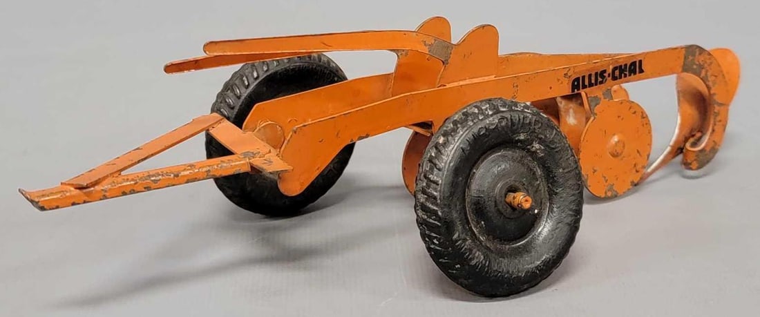 American Precision pressed steel Allis Chalmers promotional 2 bottom plow: American Precision pressed steel Allis Chalmers promotional 2 bottom plow, good to very good condition as the wheels are Auburn rubber and this variation has a decal instead of embossed letters