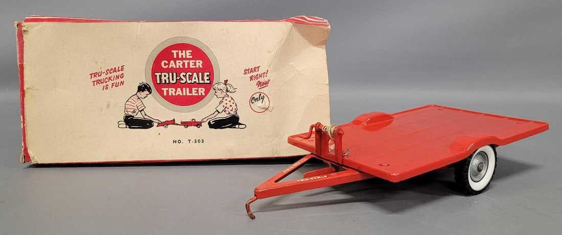 Carter Tru-Scale pressed steel Trailer in original box: Carter Tru-Scale Trailer in original box. Trailer is in excellent condition with minor paint wear. Comes in a fair original box that is missing all of the flaps from one end and all of the flaps from 
