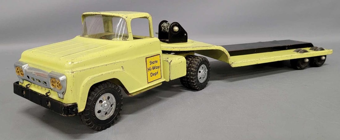 Tonka pressed steel lime green State Hi-Way Dept lowboy semi tractor trailer: Tonka lime green State Hi-Way Dept lowboy semi tractor trailer in good to very good condition. Truck and trailer has scratching and paint chips as seen in the photos.