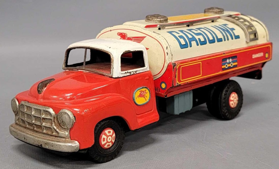 Yonezawa Japan Mobil gasoline Pegasus tin friction truck: Yonezawa Japan Mobil gasoline Pegasus tin friction truck in very good condition. Tank has several dents on back and top and is missing one of the rails on the top of the tank and friction works well a