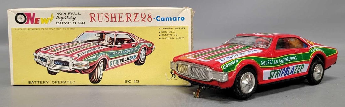 Rusher Z28 Camaro battery operated tin car in original box actually an Oldsmobile Toronado: Rusher Z28 Camaro battery operated tin car in original box. Car is in excellent plus condition, the lights work but the motor does not run and comes in an excellent original box as seen in the photos.