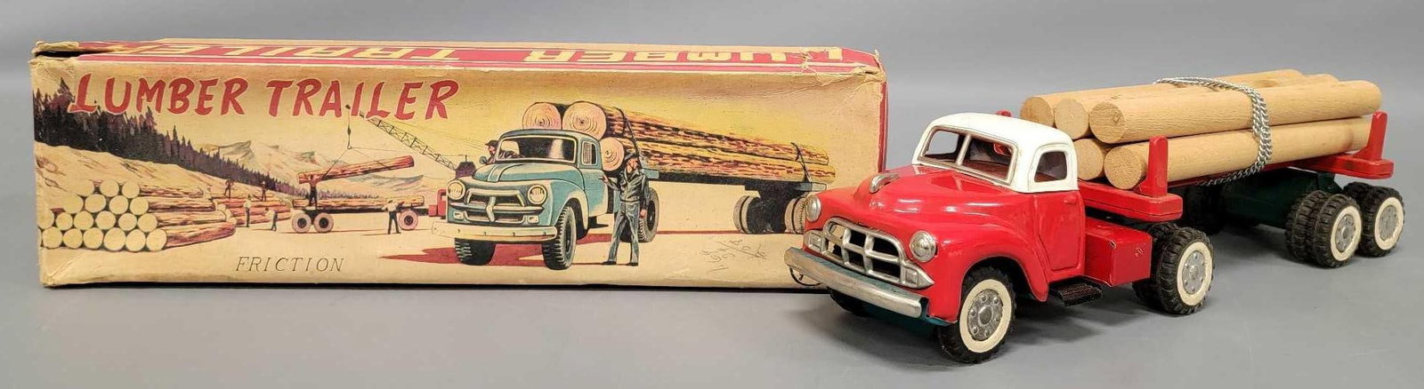 Yamaichi Japan tin friction lumber trailer in original box: Yamaichi Japan tin friction lumber trailer in original box, truck and trailer are in excellent condition and come in a good original box as seen in the photos.