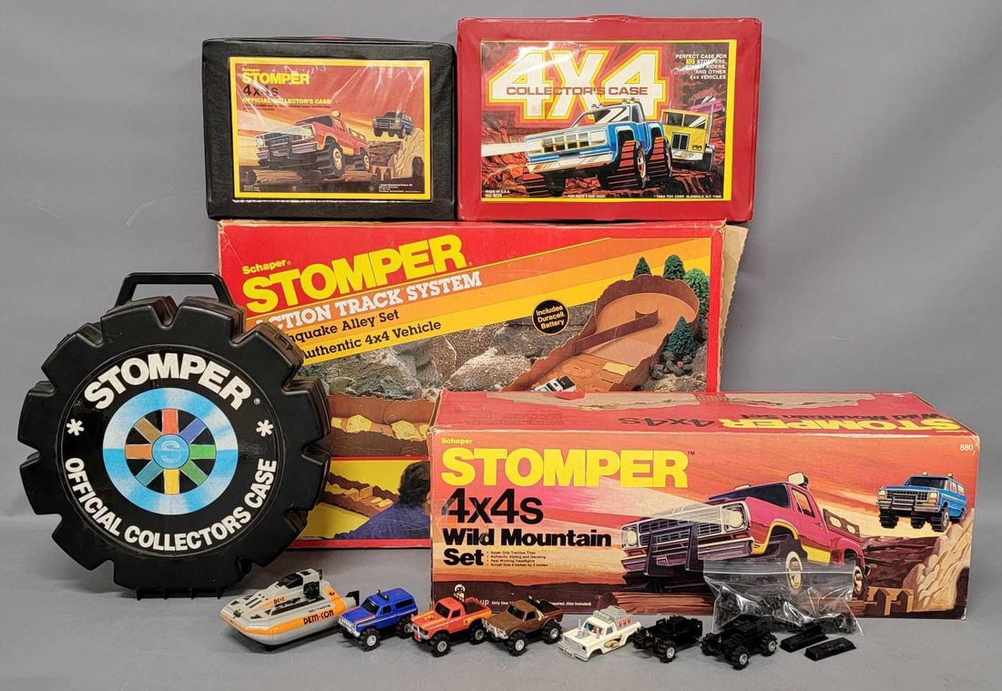 Schaper Stompers Wild Mountain set and Action Track System plus cases tires and untested chassis etc: Schaper Stompers Wild Mountain set and Earthquake Alley Action Track System plus cases tires and untested chassis. Includes two complete track sets but NO cars or trucks to go with them, a bag of nice