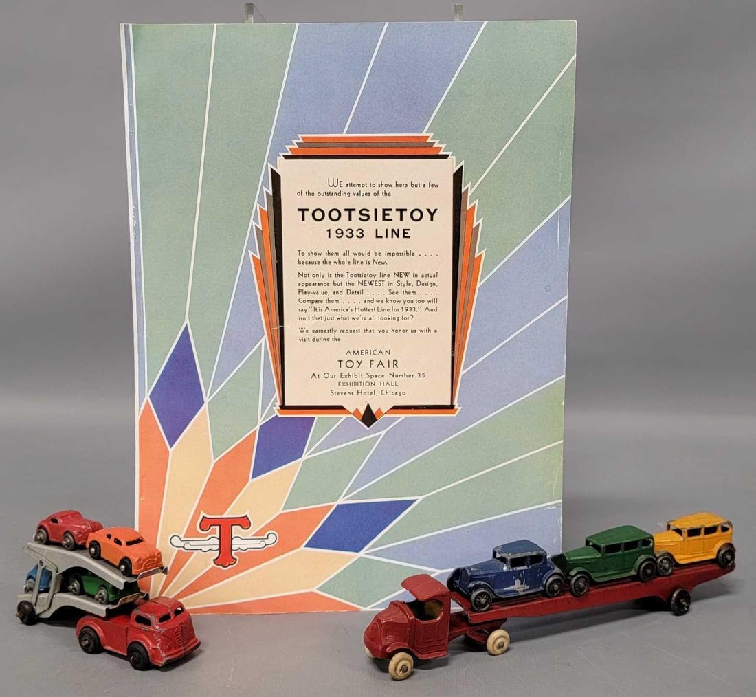 Tootsietoy die cast car carrier with 3 cars and 1933 Toy Fair catalog plus barclay car carrier: Tootsietoy die cast car carrier with 3 cars and 1933 Toy Fair catalog plus barclay car carrier. The car carriers are both in very good to excellent condition with nice cars. The catalog is in very goo