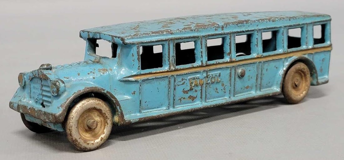 Arcade cast iron blue Fageol bus: Arcade cast iron blue Fageol bus, all original in good condition as seen in the photos. Measures 8 inches long.