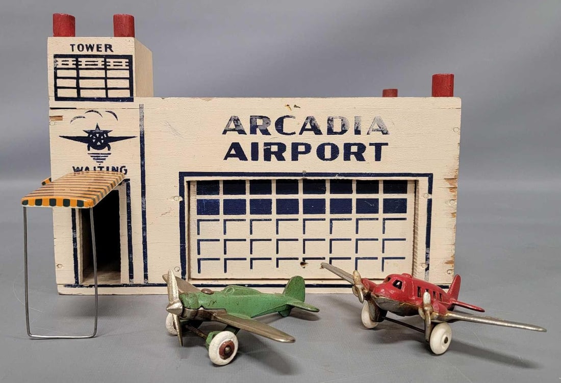 Arcade Toys wooden Arcadia Airport with airplanes and tin awnings: Arcade Toys wooden Arcadia Airport with airplanes and tin awnings in very good to excellent condition with some corner wear but it is complete and very clean overall with nice bright tin lithographed 