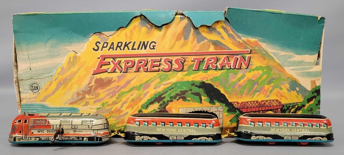 Marusan Toys Japan tin lithographed wind-up Sparkling Express Train in original box: Marusan Toys Japan tin lithographed wind-up Sparkling Express Train in original box. Comes with a streamlined locomotive that has Santa Fe livery but is marked NYC on the nose and two passenger cars m