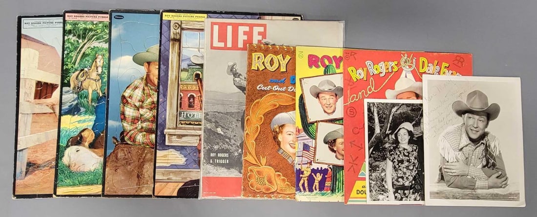 Grou of Roy Rogers and Dale Evans ephemera and puzzles: Grou of Roy Rogers and Dale Evans ephemera and puzzles to include four frame tray puzzles, three used Whitman cut out doll sets, a Life magazine from July 12, 1943 and an autographed photo to Mary tha