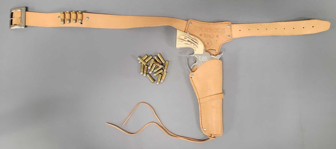 Gorgeous Mattel Fanner 50 bullet loading cap gun with near perfect holster: Gorgeous Mattel Fanner 50 bullet loading cap gun with near perfect holster. The gun has a tiny bit of wear inside but not much. It doesn't appear that any stick-m caps were fired inside. The cylin