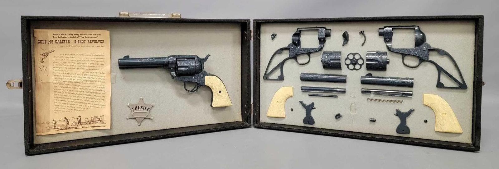 Vintage Salesman sample of a Colt 45 6 shot revolver plastic model in case: Vintage Salesman sample of a Colt 45 6 shot revolver plastic model in case. Includes a built example and an unbuilt example, both attached to the inside of the case along with an instruction sheet for