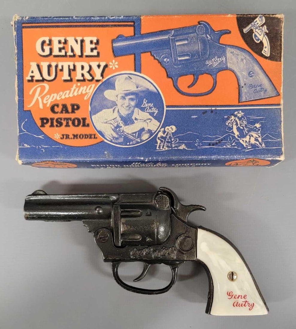 Kenton cast iron Gene Autry junior cap pistol in original box: Kenton cast iron Gene Autry junior model cap pistol in original box. The pistol is in excellent condition with minor wear to the lettering on the grips. It does not appear to have ever had a cap fired