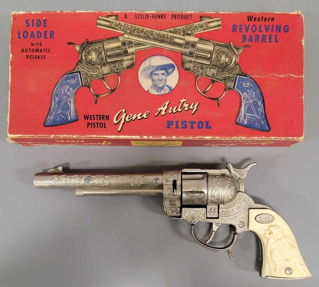 Leslie Henry Gene Autry 50 shot repeating cap pistol in original box No 44: Leslie Henry Gene Autry 50 shot repeating cap pistol in original box, stock number 44. The cap gun shows minimal play wear and in excellent condition and works perfectly with a revolving cylinder. It 