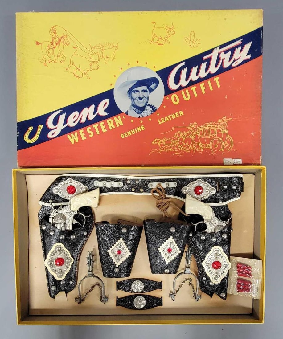 Fantastic unused Leslie henry Gene Autry leather holster and cap gun set in original box: Fantastic unused Leslie henry Gene Autry leather holster and cap gun set in original box. The leather holster and cuffs are very nice but one cuff had the snaps fall apart but the leather and decorati