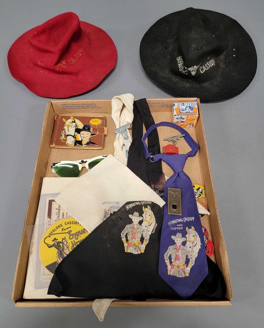 Group of vintage Hopalong Cassidy collectibles: Group of vintage Hopalong Cassidy collectibles to include two felt hats, junior chow set in original box, sunglasses, five neckerchiefs and ties, a wallet, a cheap childs holster, five pinbacks, tiny 