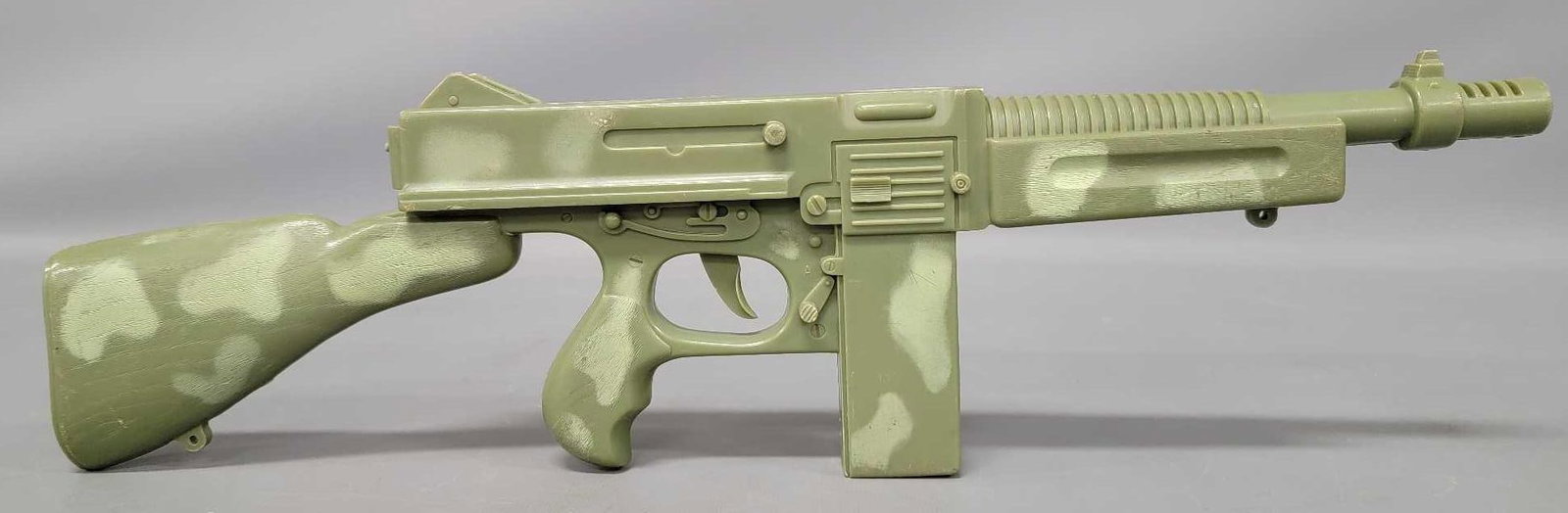 Vintage Marx Machine gun: Vintage Marx Machine gun, made completely of plastic and works perfectly making a nice loud sound that many of us remember making as kids in the department store toy aisles. Measures 19 1/4 inches lon