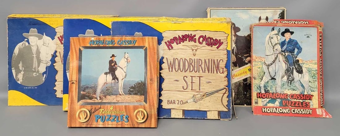 Group of seven Hopalong Cassidy puzzles and three wood burning sets in original boxes: Group of seven Hopalong Cassidy puzzles and three wood burning sets in original boxes. The woodburning sets have fair to very good original boxes, two appear unused and one is partially used as seen i