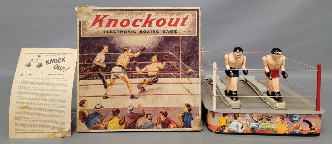 Northwestern Products Knockout electronic boxing game in original box: Northwestern Products Knockout electronic boxing game in original box. The boxers are undamaged and both work but have some paint loss, the ring top surface is scratched up from play wear but the rope