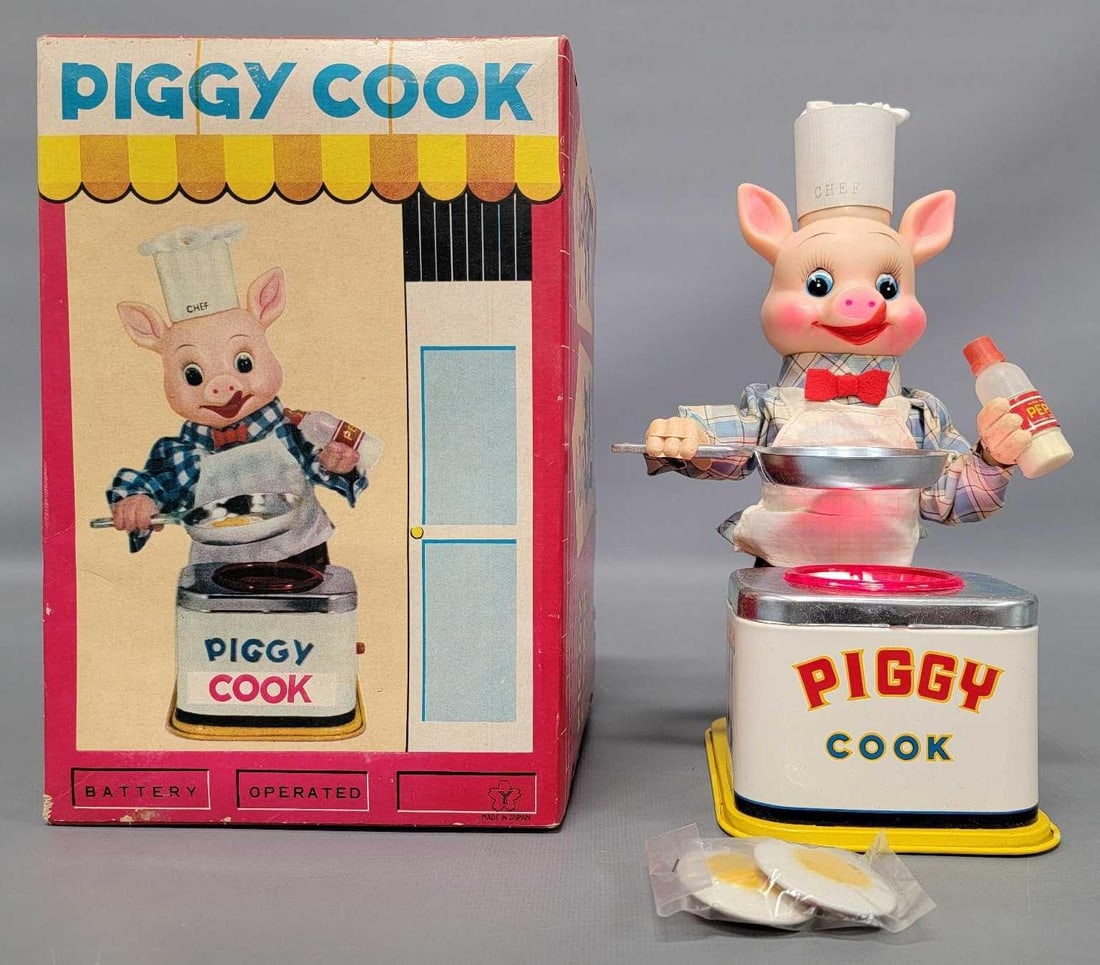 Yonezawa Piggy Cook battery operated toy in original box: Yonezawa Piggy Cook battery operated toy in original box, complete with the ham / eggs but does not work, otherwise in excellent condition in an excellent original box as seen in the photos.