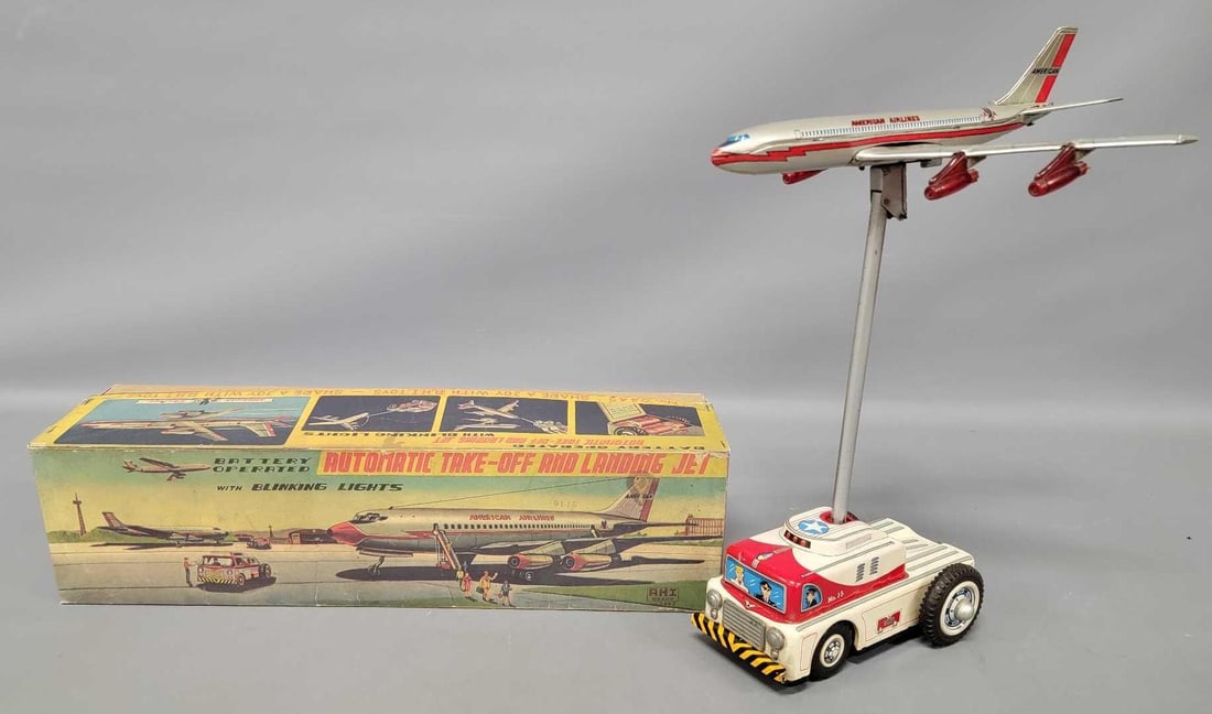 Nomura Ahi American Airlines tin lithographed battery operated jet toy: Nomura Ahi American Airlines tin lithographed battery operated jet toy in a photocopied original box. The jet is in very good to excellent condition but does not work. The box looks neat but is defini