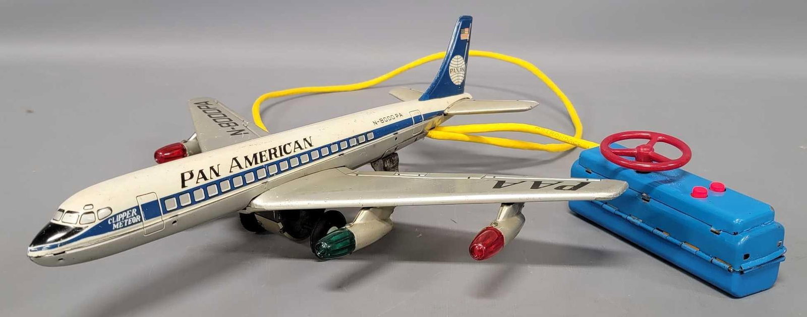 Linemar tin battery operated remote control Pan American jet: Linemar tin battery operated remote control Pan American jet in very good condition, tested and works as seen in the photos. Measures 13 1/4 inches long.