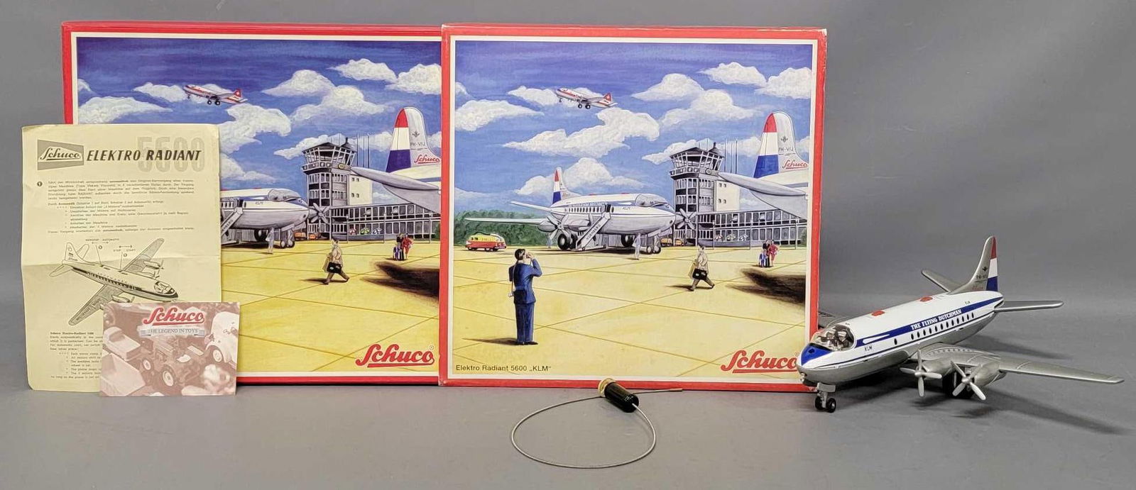 Reproduction Schuco Elektro Radiant 5600 KLM tin lithographed battery operated airplane in OB: Reproduction Schuco Elektro Radiant 5600 KLM tin lithographed battery operated airplane in original box, stock number 00216. The plane is near mint to mint in an excellent original box with original p