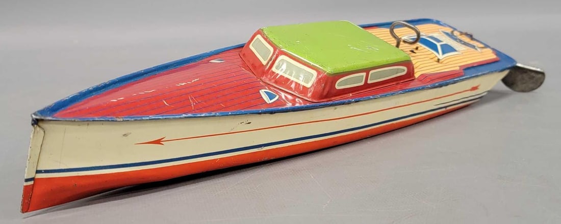 Lindstrom tin lithographed wind-up boat: Lindstrom tin lithographed wind-up boat in very good to excellent condition as seen in the photos. Measures 15 1/2 inches long to the back of the rudder, works nicely..