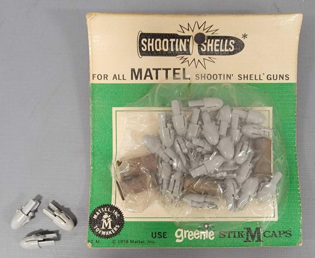 Mostly unused packet of Mattel Shootin Shell bullets: Mostly unused packet of Mattel Shootin Shell bullets. The shrink wrap is torn along the left side and five of the tips are loose and there appears to be another 25 or more in the package along with fo