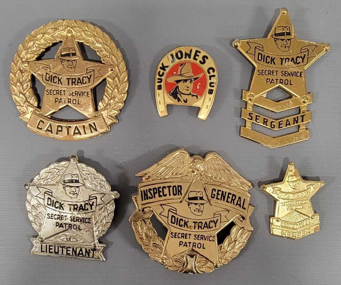 Group of vintage Quaker Oats Dick Tracy Secret Service Patrol badges: Group of vintage Quaker Oats Dick Tracy Secret Service Patrol badges to include Sergeant, Lieutenant, Captain, Inspector General and second year member plus a Buck Jones Club pin, all in very good to 