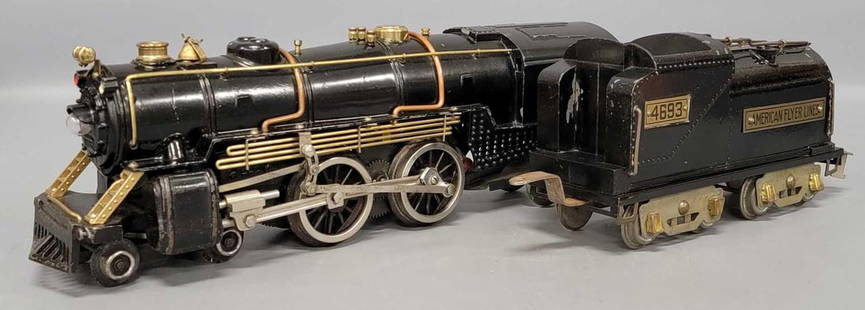 American Flyer wide gauge 4696 4695 brass piper steam locomotive with 4693 tender: American Flyer wide gauge 4696 4695 brass piper steam locomotive with 4693 tender. The locomotive has a lighted fire box and bell, some paint wear on the pilot and roof, otherwise very nice, C7. The t