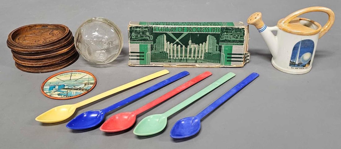 Group of mixed souvenirs from 1933 Chicago Worlds Fair and 1939 New York Worlds Fair: Group of mixed souvenirs from 1933 Chicago Worlds Fair and 1939 New York Worlds Fair consisting of 1939 Worlds Fair round glass bank Syroco Wood four drink coasters one metal coaster one china waterin