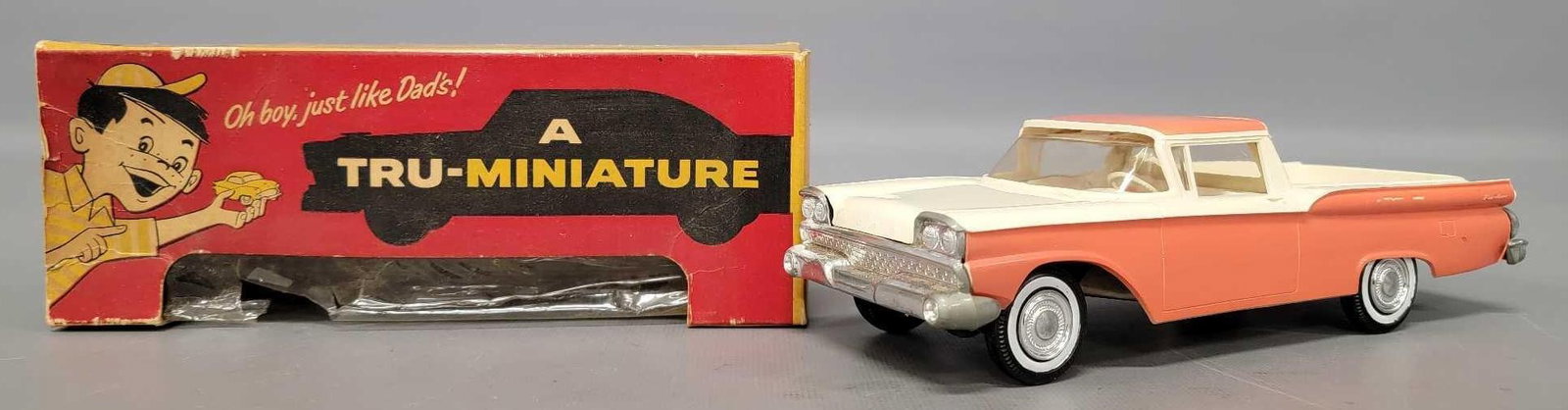 1959 Ford Ranchero friction promo car in original box: 1959 Ford Ranchero friction promo car in original box, coral / white, with a poorly working friction mechanism, very good to excellent condition in a good original box as seen in the photos.