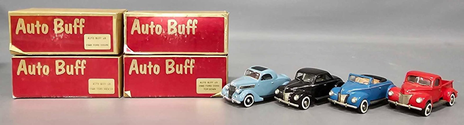 Four Auto Buff 1/43 die cast models in original boxes: Four Auto Buff 1/43 die cast models in original boxes to include and 1940 Ford coupes, 1940 Ford convertible top down and 1940 Ford pickup, all good to excellent condition as seen in the photos.