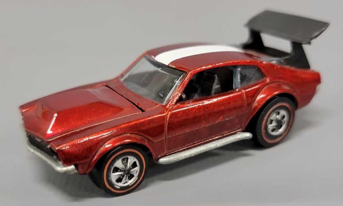 Redline Hot Wheels red Mighty Maverick: Redline Hot Wheels red Mighty Maverick, car is in excellent condition, the left side a pillar has a slight bend, the base is shiny and paint has some toning on both sides as seen in the photos.