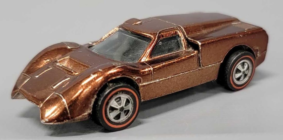 Redline Hot Wheels brown Ford J Car: Redline Hot Wheels brown with black interior Ford J Car, car is in excellent plus condition with a few flea bites and minor edge wear on the rear corners has a shiny base as seen in photos.