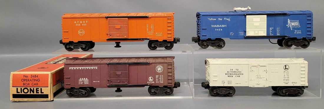 Four Lionel postwar O operating freight cars with one original box (1 of 9)