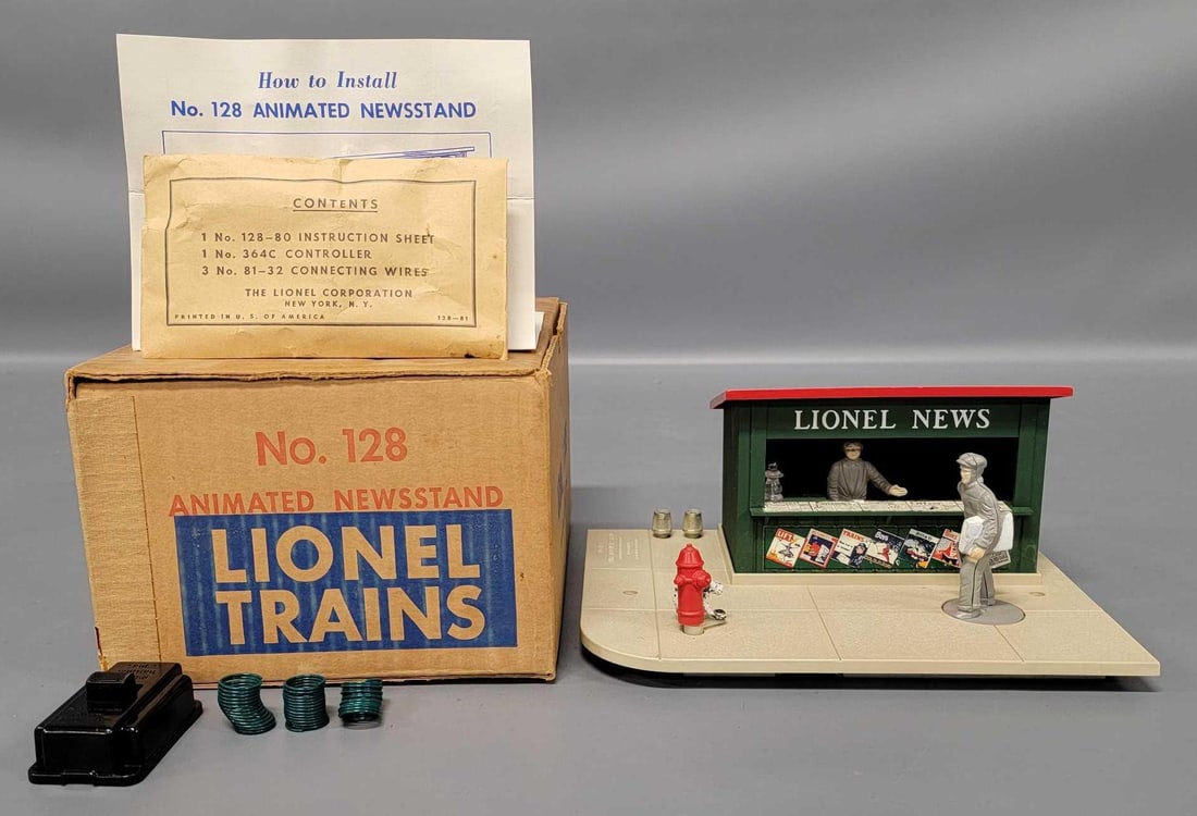 Lionel postwar O 128 animated newsstand in original box: Lionel postwar O 128 animated newsstand in original box, shows light run time and is C8 in an excellent original box as seen in the photos.
