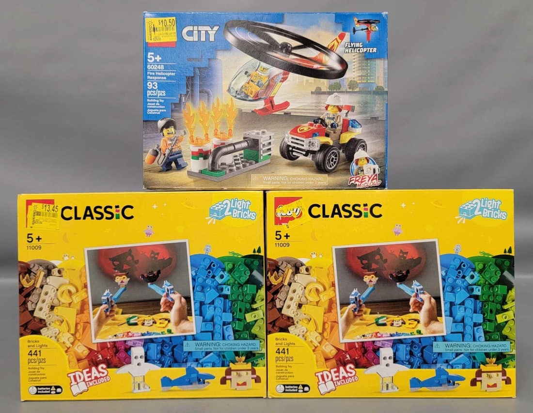 Three factory sealed Lego kits Classic and Flying Helicopter: Three factory sealed Lego kits. Two Classic kits with light bricks and one Flying Helicopter kit in mint condition as seen in the photos.