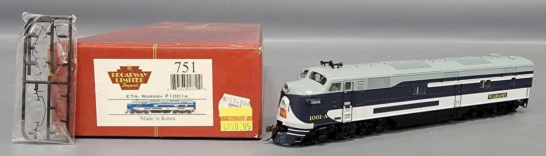 Broadway Limited Imports HO Wabash E7A diesel locomotive in original box: Broadway Limited Imports HO Wabash E7A diesel locomotive in original box. Cab number 1001A, stock number 751. Shows very light run time and is C8 in a good original box with damage from moisture as se