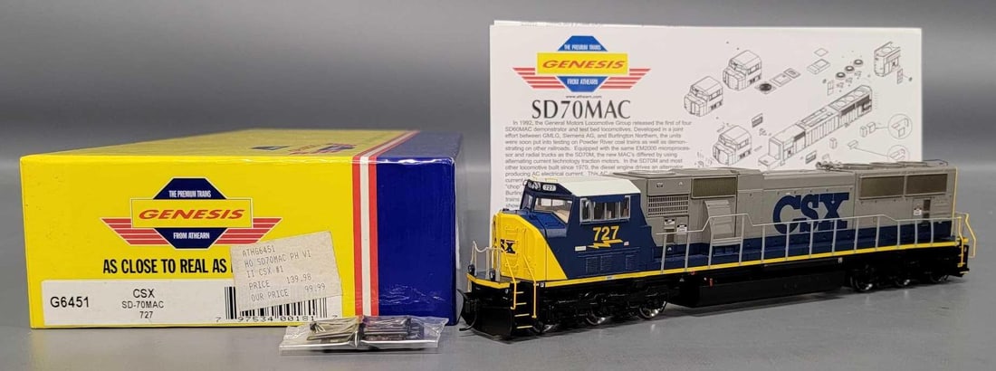 Athearn Genesis HO CSX SD-70MAC diesel locomotive in OB: Athearn Genesis HO CSX SD-70MAC 6-6 diesel locomotive cab number 727 stock number G6451 C9-10 unrun with rails in factory sealed bags and all original paperwork in an excellent original box as seen in
