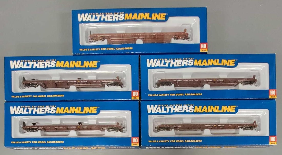 Five Walthers Mainline HO 75' Piggyback Flat Cars in OB: Five Walthers Mainline HO 75 foot Piggyback Flat Cars consists of one Pennsylvania and two Trailer Train Flat Cars and two Trailer Train ATTX Flat Cars unrun in warped boxes due to moisture damage as 