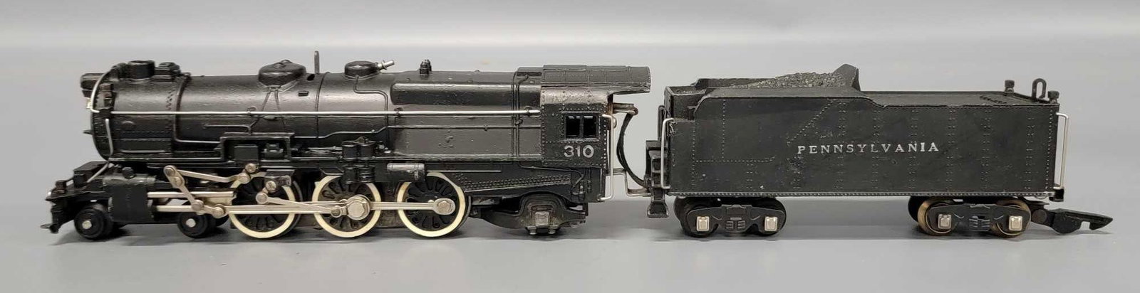 American Flyer S gauge 310 Pennsylvania 4-6-2 steam locomotive: American Flyer S gauge 310 Pennsylvania 4-6-2 steam locomotive, missing the smoke in tender internal components and shows light run time and is C6-7 as seen in the photos.